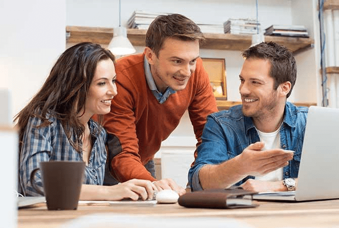 family looking at computer